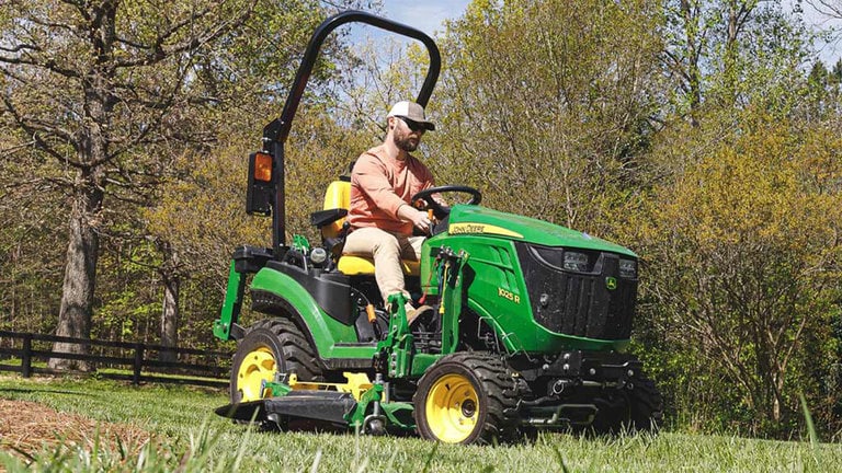 John Deere 1025R with attachments