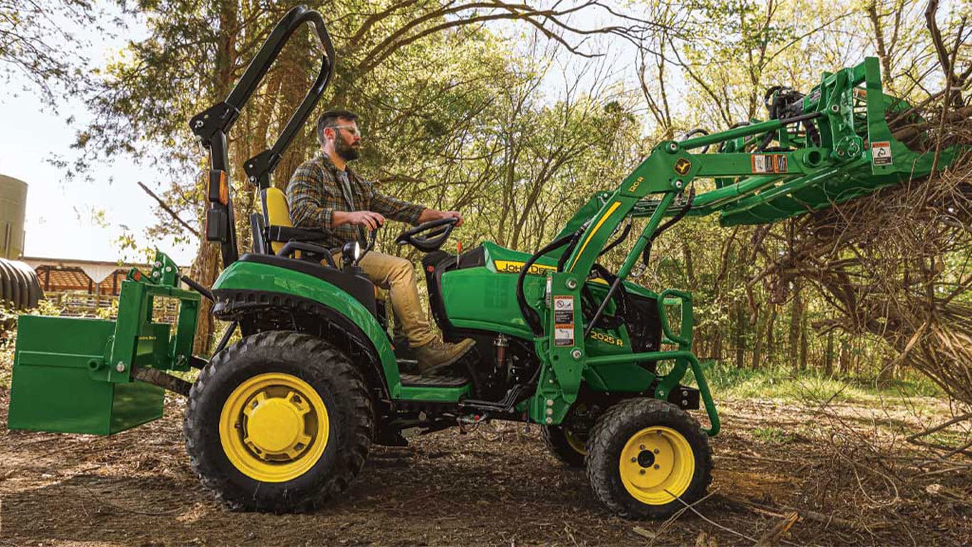 John Deere 2025R with attachments