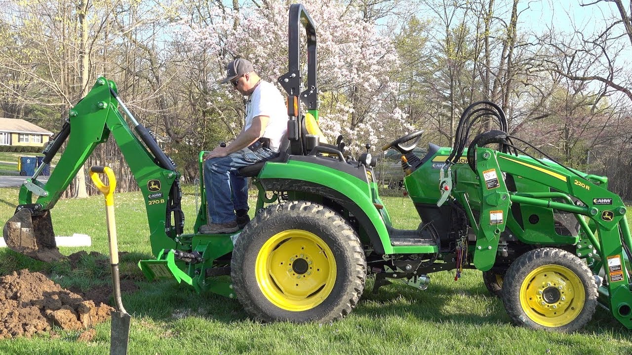 John Deere 2038R with attachments