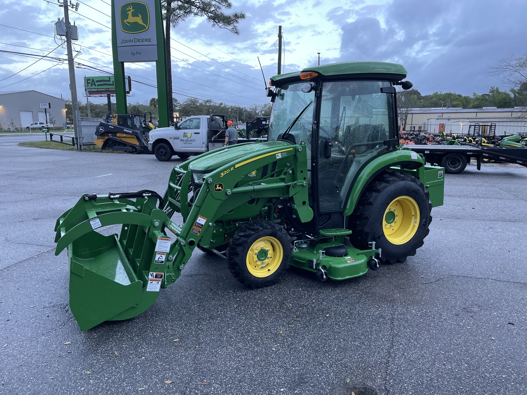 John Deere 3039R with attachments